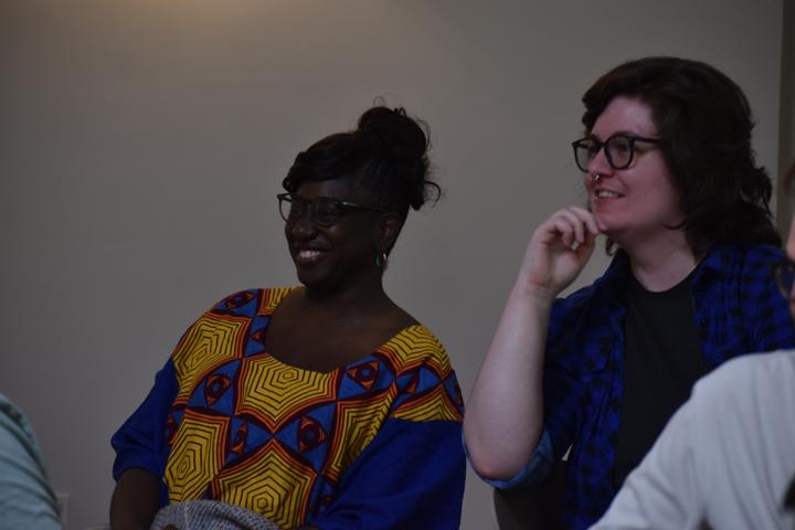 Two people laughing together.